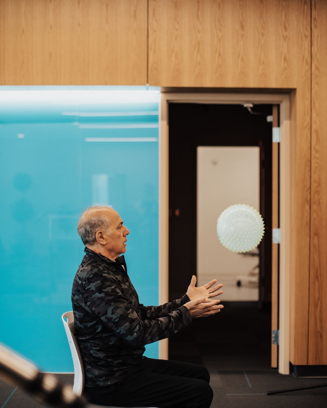 Patient using NeuroAnimation therapy equipment